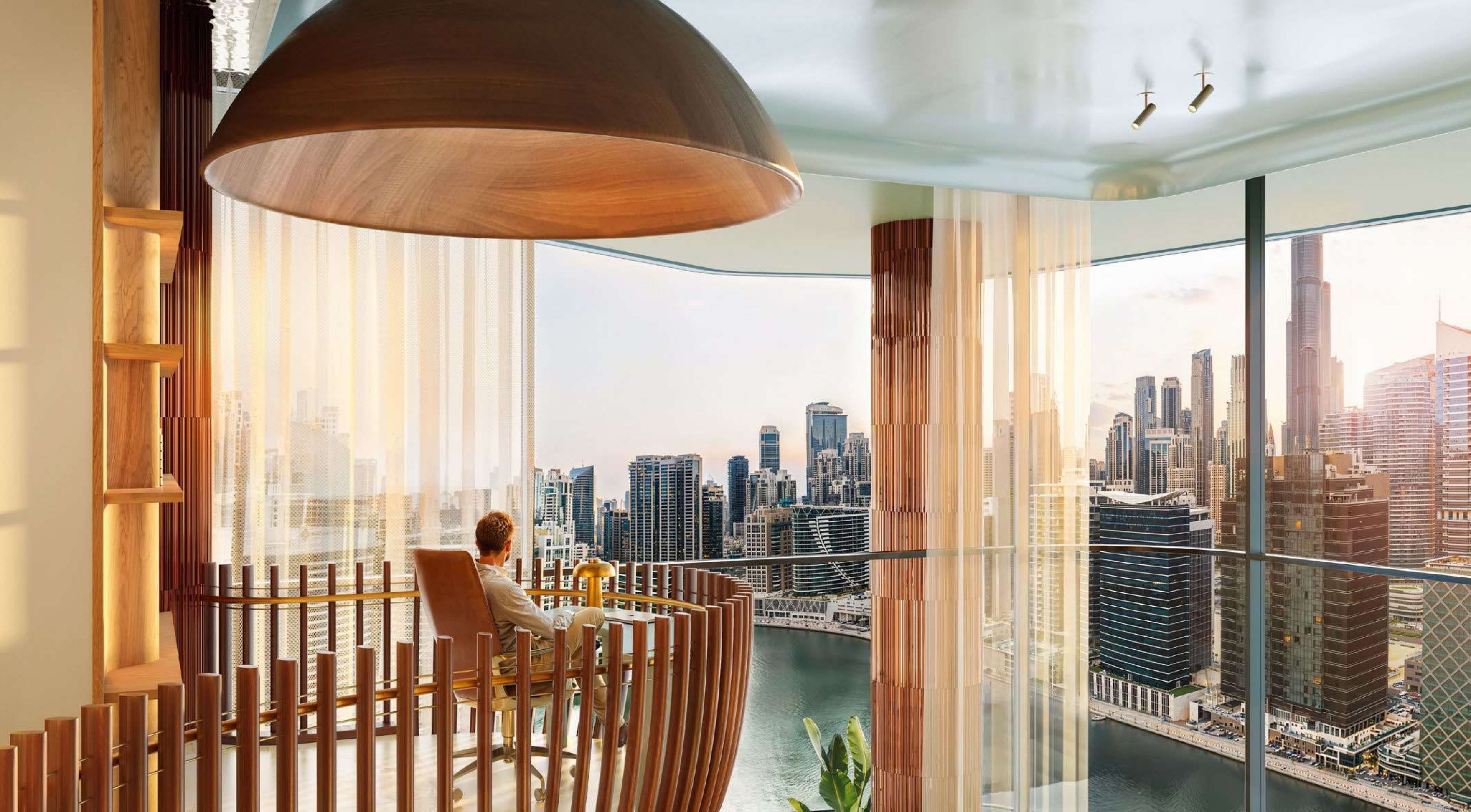 EYWA Way of Water — interior living space with panoramic Business Bay canal views at sunset